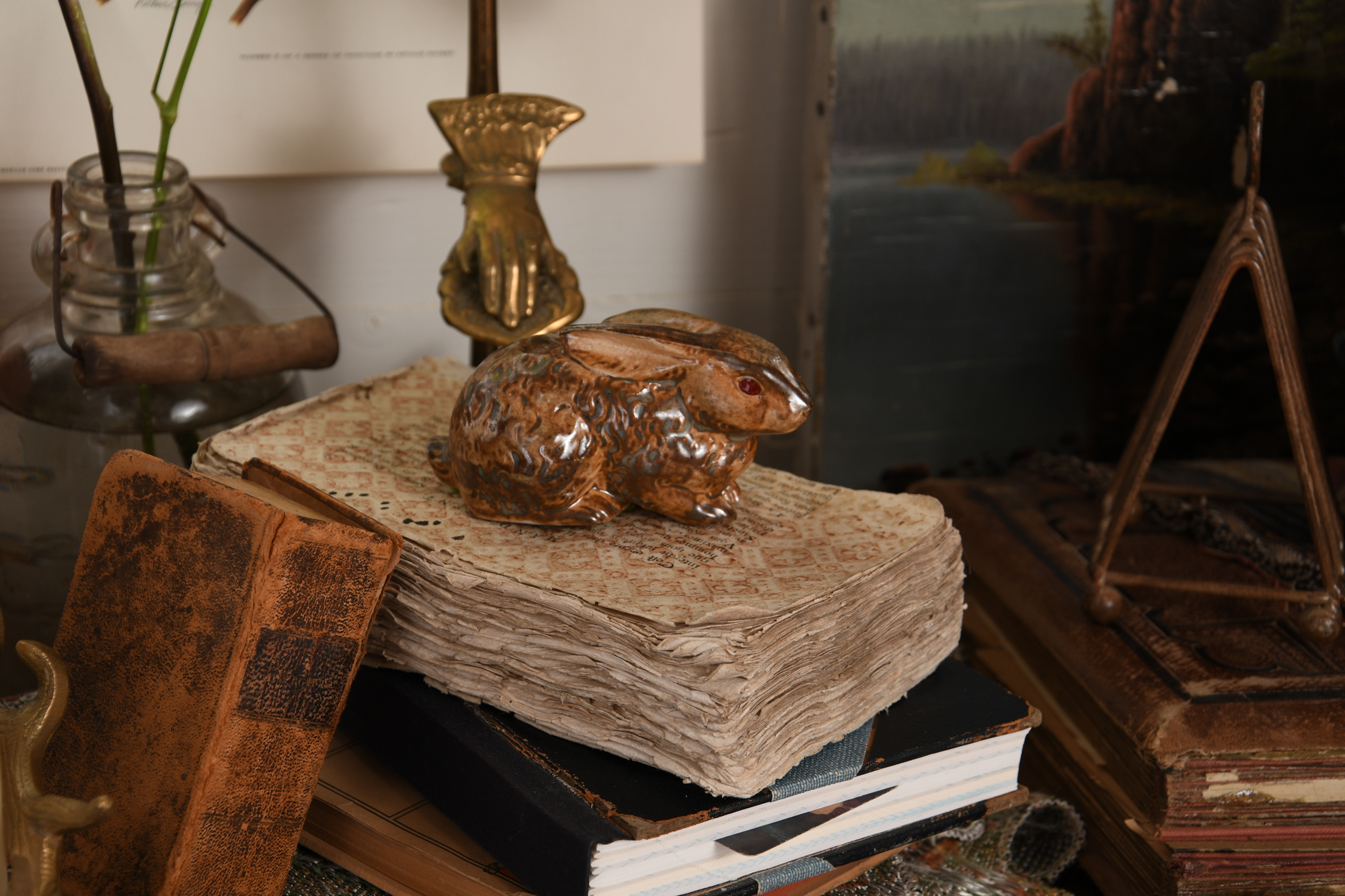 Bunny sitting on vintage book papers